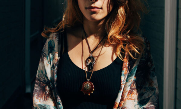 A woman with tattoos and a black top