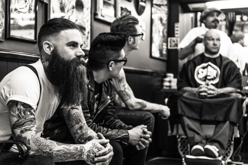 A group of men sitting next to each other.
