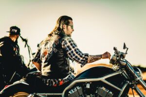A man riding on the back of a motorcycle.