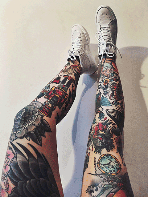 A person with tattoos on their legs and feet.